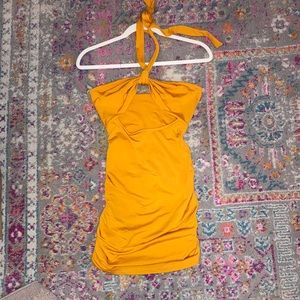 A orange halter mini dress with stomach cut out. Super cute and flattering.
